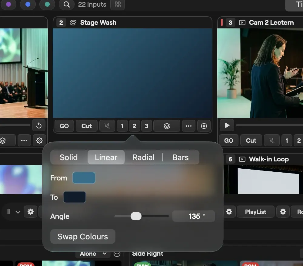 The colour editor on macOS for the Stage Wash input: Solid, Linear, Radial and Bars, with a linear gradient from blue to navy, the angle at 135 degrees and Swap Colours