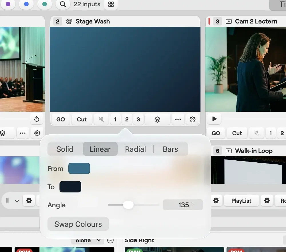 The colour editor on macOS for the Stage Wash input: Solid, Linear, Radial and Bars, with a linear gradient from blue to navy, the angle at 135 degrees and Swap Colours